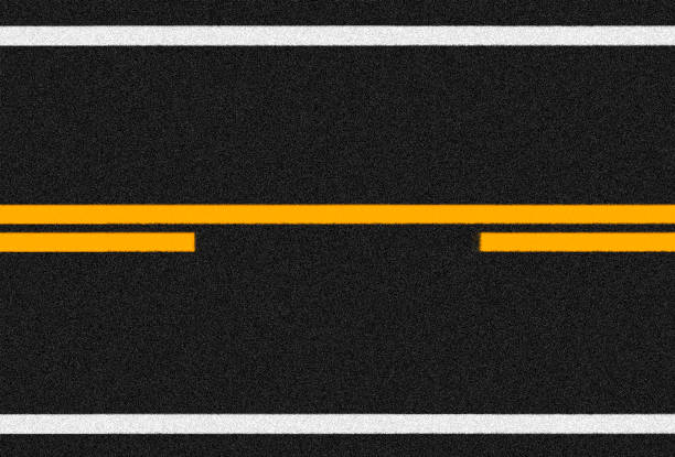 istock Asphalt road surface with orange and white lines 1316130239