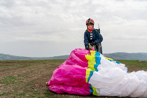 woman carrying her parachute