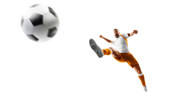 Isolated. Soccer kick. A soccer player kicks the ball in air fashion. Professional soccer player in action. Sport