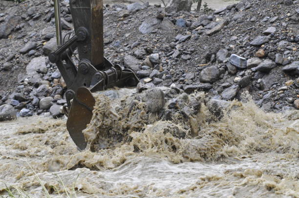istock regulating water stream with excavator for flood control 1316136925