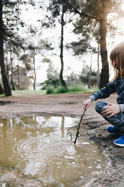 istock Girl playing in the puddle 1316136996