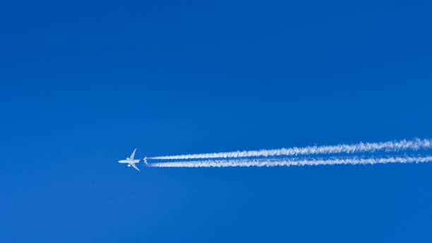 istock A passenger plane flies at high altitude and leaves a condensation trail behind it. 1316138020