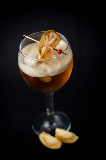 istock Delicious cocktail with orange on black background 1316138169