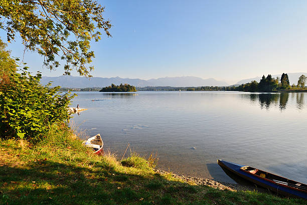 Bavaria Peaceful view of lake Staffelsee with the Alps in the background on a sunny autumn afternoon. lake staffelsee photos stock pictures, royalty-free photos & images
