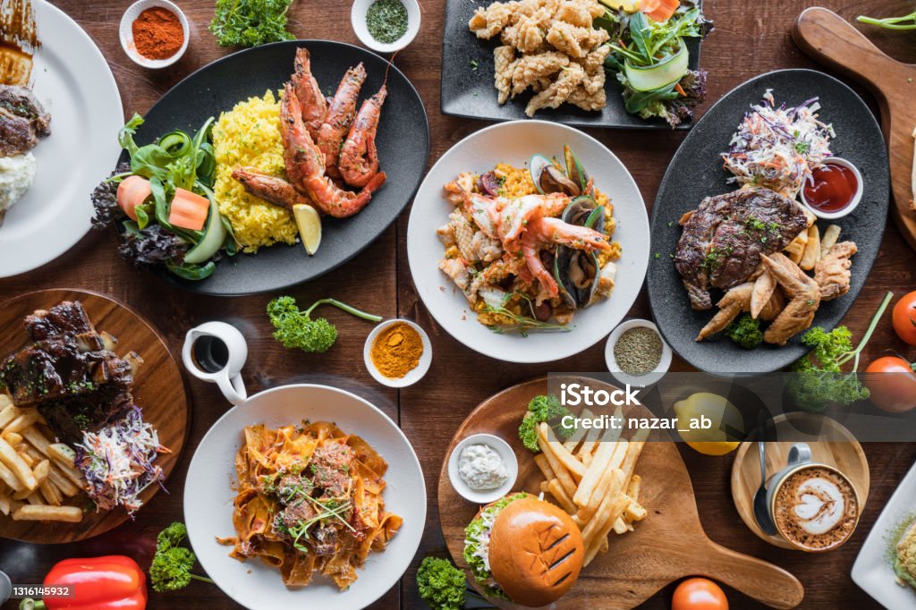 Table top view of spicy food. Top looking down at restaurant food spread on table. Food Stock Photo