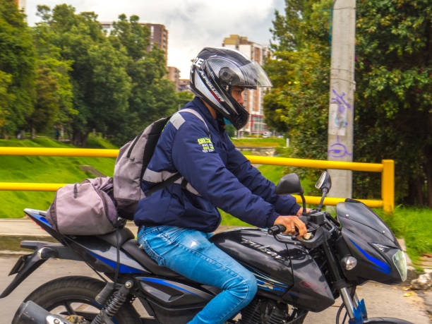 Man riding a motorcycle in the streets of Bogota - Colombia stock photo