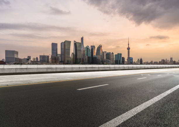 istock empty asphalt road with city skyline background in china 1316156743
