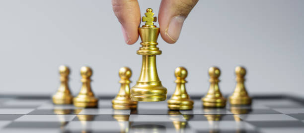 istock gold Chess king figure Stand out from the crowd on Chessboard background. Strategy, leadership, business, teamwork, different, Unique and Human resource management concept 1316159933