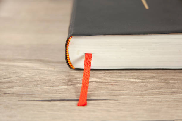 istock Bible and tab on wooden table 1316165396