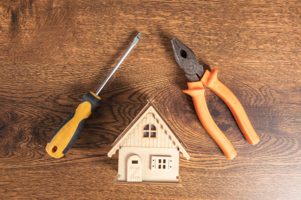istock house model with screwdriver and pliers 1316165450
