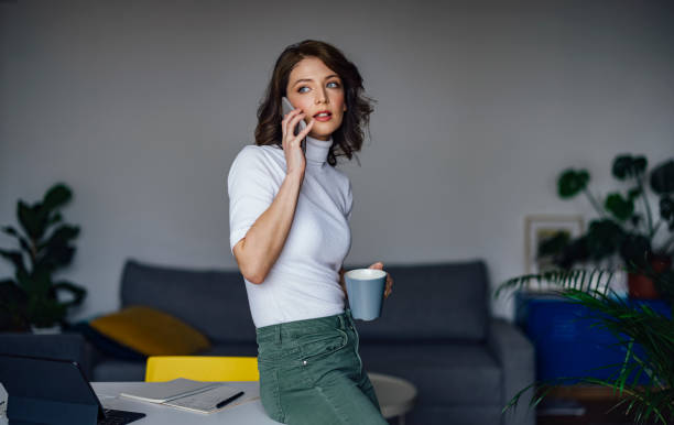 istock Young female professional talking on smart phone 1316173023