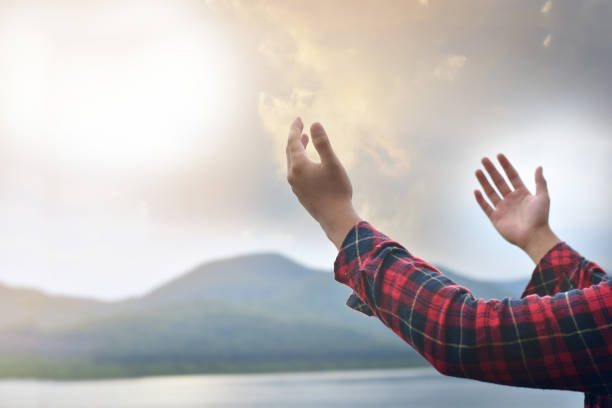istock Praying hands of young man 1316175997