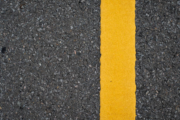 istock Close up road divide yellow twin line 1316176000
