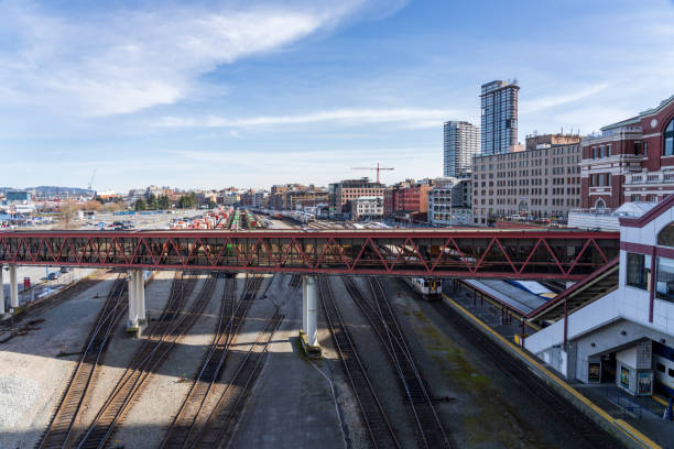 Vancouver, Canada - August 17, 2023: Aerial view over Vancouver in Canada with an elevated railroad track and some modern office buildings.