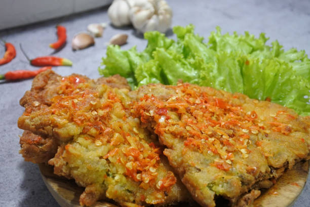 istock Crispy Eggs on a Wooden Plate 1316178339