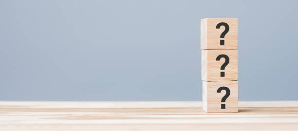 istock Questions Mark ( ? ) on wooden cube block on table background. FAQ( frequency asked questions), Answer, Q and A, Information, Communication and interrogation Concepts 1316179200