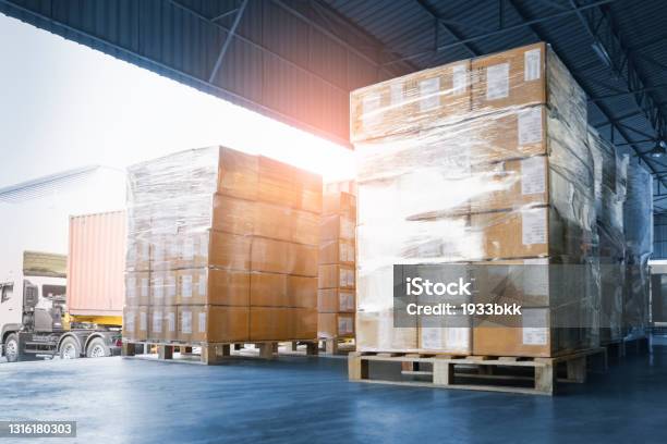Stacked Of Package Boxes Loading Into Container Truck Truck Parked Loading At Dock Warehouse Delivery Service Shipping Warehouse Logistics Shipment Freight Truck Transportation Stock Photo - Download Image Now