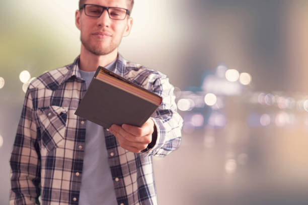 adult man with book and coffee, teacher
