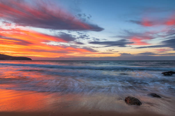 istock Sunrise at the seaside with pastel coloured clouds 1316182516