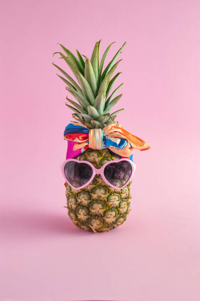 istock Creative summer idea with Pineapple hipster in sunglasses and scarf, stylish fruit. Minimal tropical concept. Art fashionable vacation concept. Summertime color mood, pineapple fruit 1316183133