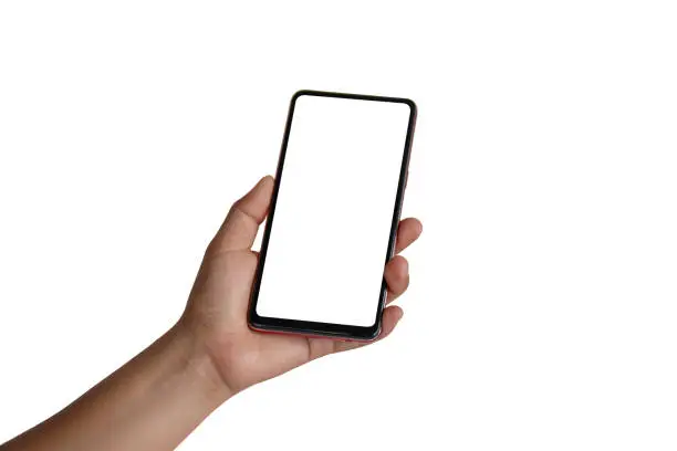 Photo of The hand is holding the white screen, the mobile phone is isolated on a white background with the clipping path.