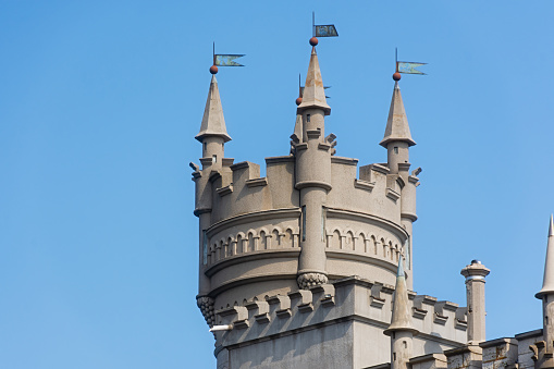 Yalta Crimea July 04, 2019. Swallow's Nest Castle is the famous castle of the peninsula. A popular tourist destination. A view from below of a sheer cliff and an architectural structure