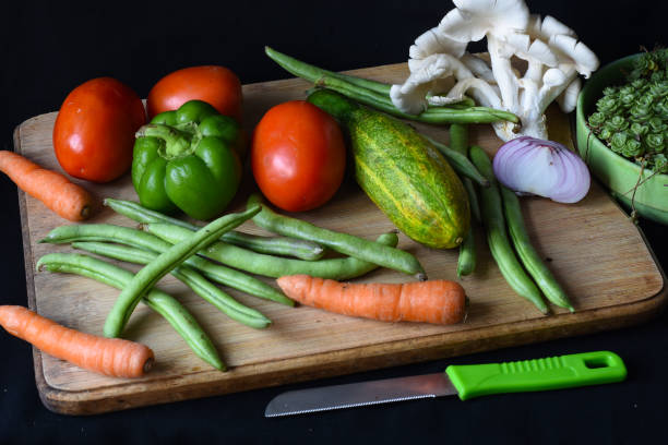 istock Vegetables on chopping board, tomatoes, bell pepper, beans . 1316187246