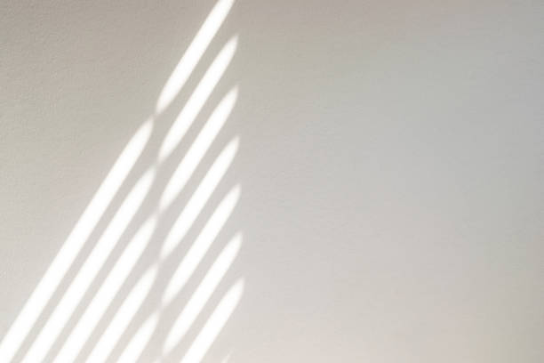 istock Lights shadows. Abstract light, black shadow overlay from window on white texture wall. Sunlight architecture background. Textures Light reflection from the window. 1316188379