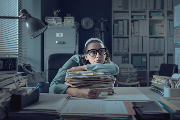 istock Frustrated office worker leaning on the desk 1316193740