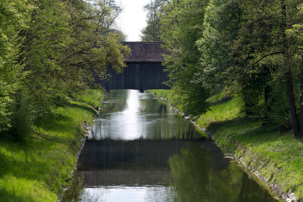 istock Old roofed wooden bridge over river Glatt at springtime. 1316195301
