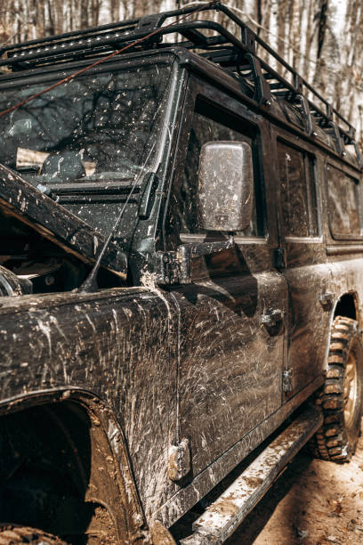 istock Dirty off road car on trip in forest 1316197248