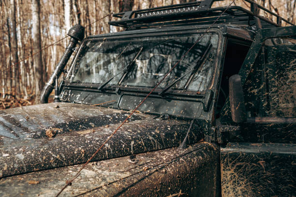istock Dirty off road car on trip in forest 1316197818