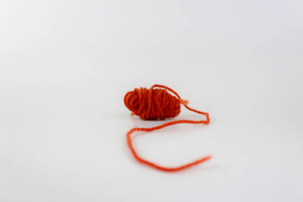 istock Red yarn with curl isolated on white background 1316198629