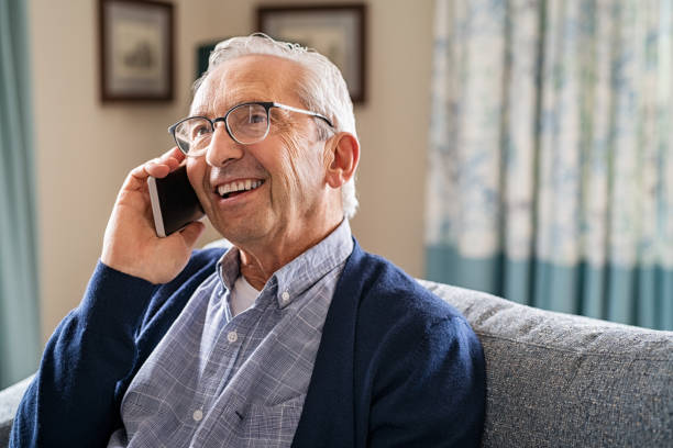 istock Happy carefree old man talking over phone 1316201910