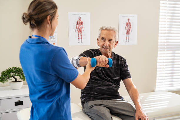 istock Physiotherapist helping senior man exercise 1316202370