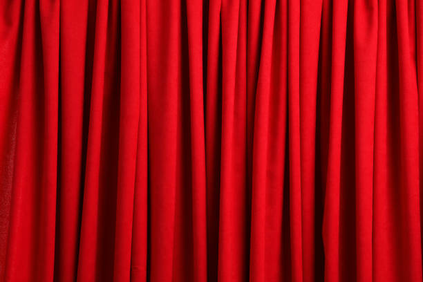 istock Closed elegant red front curtains as background, closeup 1316203483