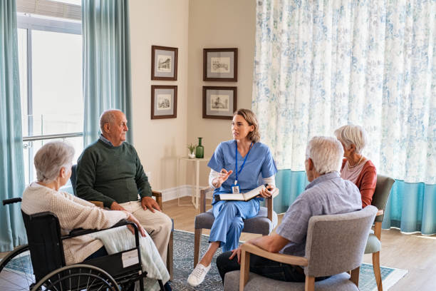 istock Nurse talking to senior people during group therapy 1316203916