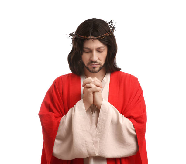 istock Jesus Christ with crown of thorns praying on white background 1316203924