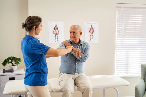 istock Physiotherapist helping senior man with his sore joint 1316204929