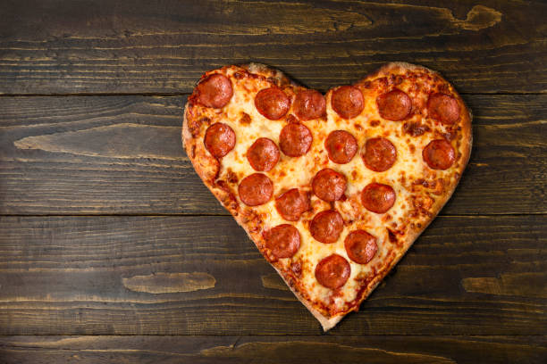 istock Heart shaped pizza pepperoni 1316205096