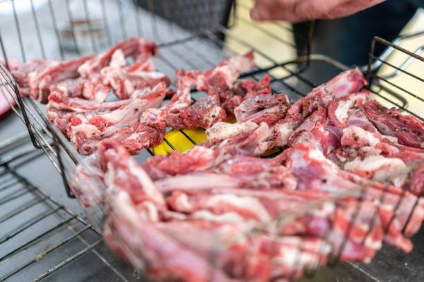 istock Lamb ribs cooked over an open fire, close-up. Lamb chops Grilling Barbecue, BBQ Originally made from lamb. Wire rack for roast lamb in the grill racks. The concept of traditional food on fire 1316205669