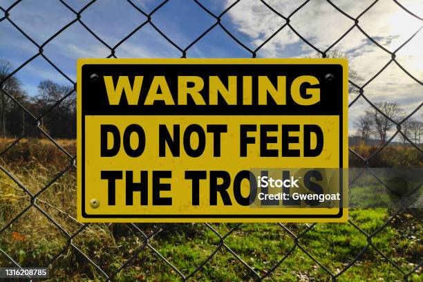 Warning Do Not Feed The Trolls Stock Photo - Download Image Now - Black Color, Brand Name Online Messaging Platform, Color Image