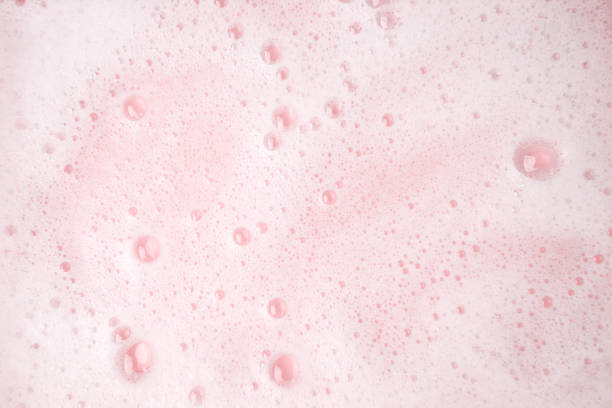 istock White foam bubbles texture on pink pastel background, copy space, banner for loundry, cleaning service, bathroom concept, clean, wash - liquid soap, shower gel, shampoo 1316208817