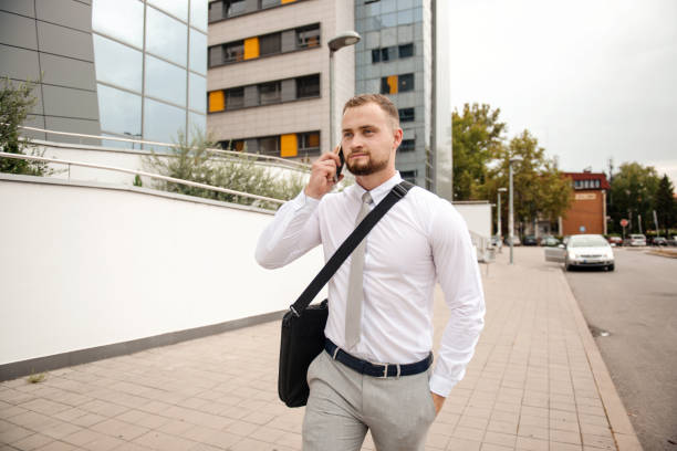 istock Young businessman using his phone outdoor 1316209372