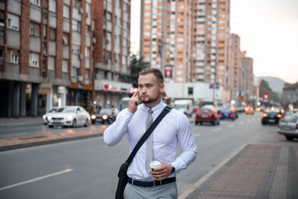 istock Young businessman using his phone outdoor 1316209488