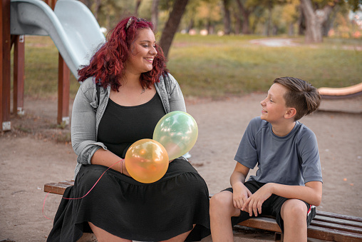 Siblings is talking in the park