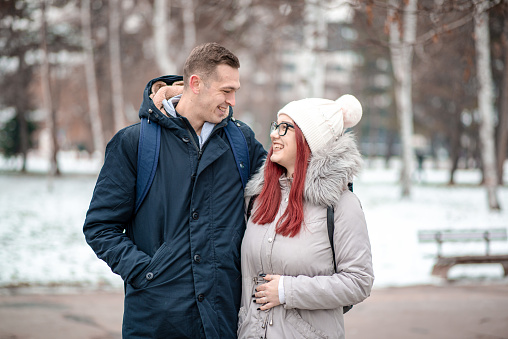 Hugged couple looking to each other