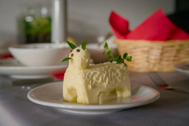 This is an overhead view of a classic Danish dessert, Gåsebryst, which translates to “Goose-breast.” Due to its shape, the recipe is more than 100 years old. It is made with a puff pastry base, a layer of jam, vanilla cream, and whipped cream in the middle, and then topped off with a layer of marzipan. It is delicious! It is served with some seasonal fruits. Please see my other pictures in this series for more variations.