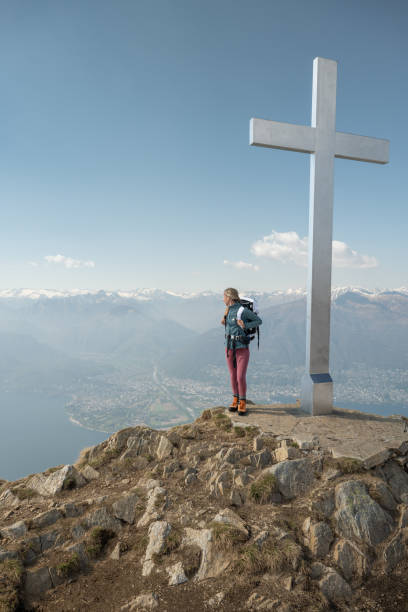 istock Hiker female contemplates view from mountain top 1316215775