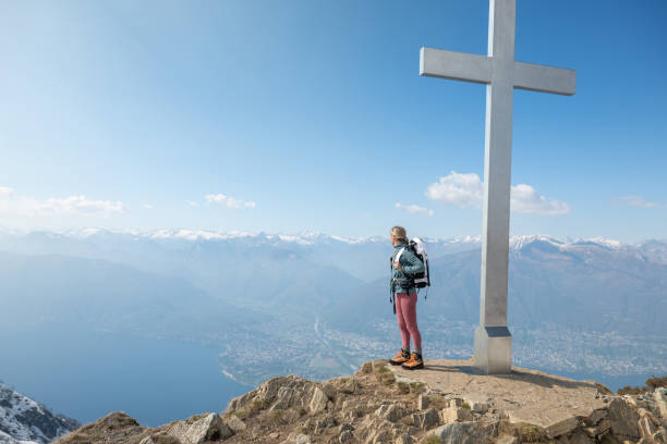 istock Hiker female contemplates view from mountain top 1316215777